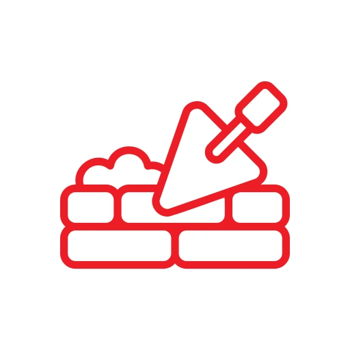 Icon of a brick wall being constructed with a trowel, depicted in red on a white background.