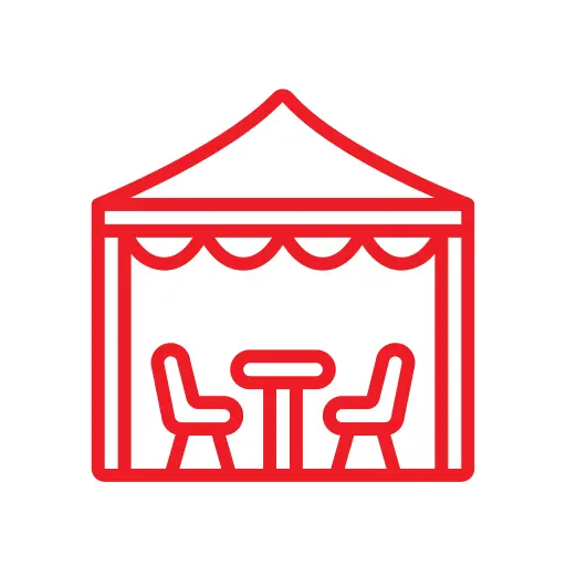 Red outline illustration of a canopy tent with two chairs and a table underneath, set within a circular border.